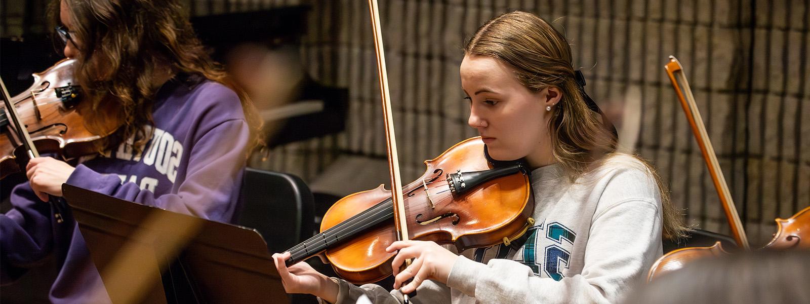 Choral and instrumental ensembles perform together