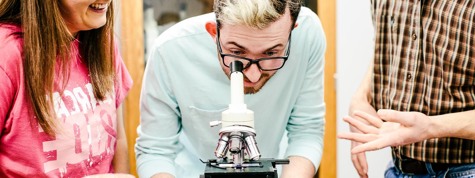 students work on physics experiment